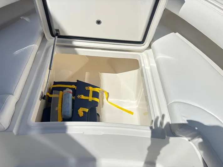  Yacht Photos Pics Open storage compartment on 2015 Regulator 34 CC boat with life jackets inside.