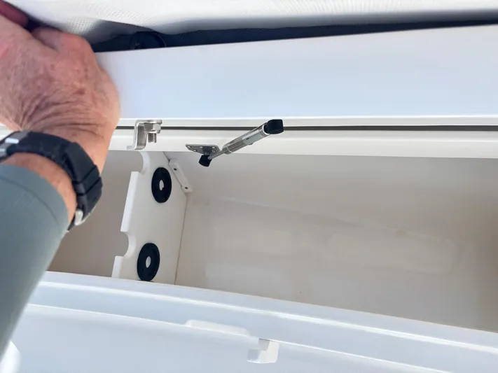 Yacht Photos Pics Open storage compartment on 2015 Regulator 34 CC boat, showing interior details.