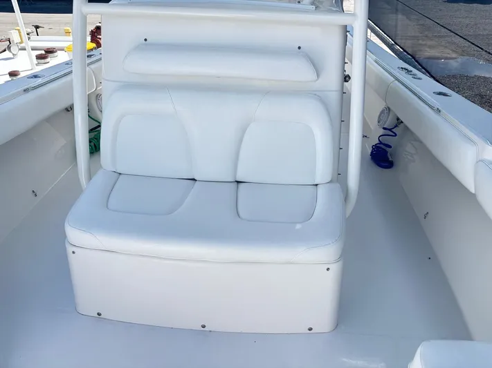  Yacht Photos Pics 2015 Regulator 34 CC boat with white cushioned seating and clean deck.
