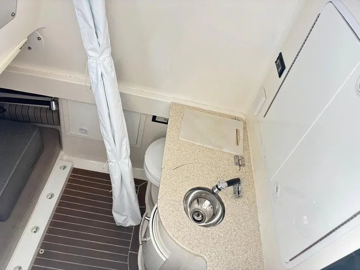  Yacht Photos Pics 2015 Regulator 34 CC cabin interior with sink, countertop, and seating area.