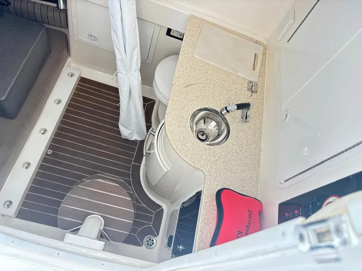  Yacht Photos Pics 2015 Regulator 34 CC boat interior with sink, countertop, and emergency kit.