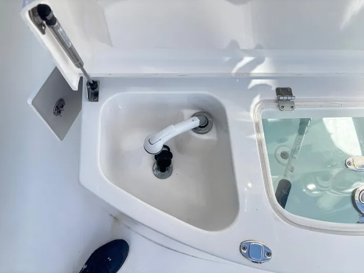  Yacht Photos Pics 2015 Regulator 34 CC boat sink and storage compartment detail.