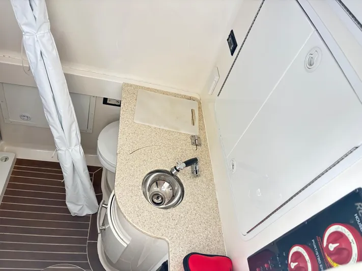  Yacht Photos Pics 2015 Regulator 34 CC boat interior with sink, countertop, and storage compartments.