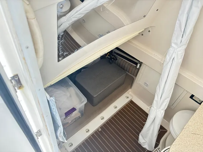  Yacht Photos Pics 2015 Regulator 34 CC cabin interior with storage and toilet.