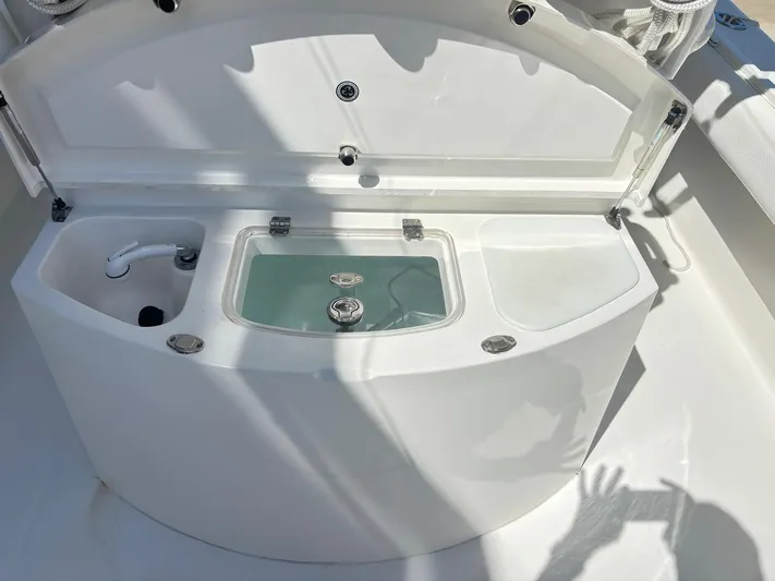  Yacht Photos Pics 2015 Regulator 34 CC boat livewell and storage compartments open on deck.