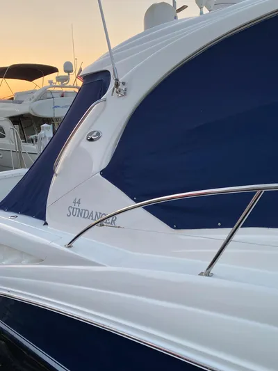 Lowest Price In Usa Yacht Photos Pics 2008 Sea Ray 44 Sundancer yacht with blue canvas at sunset in marina.