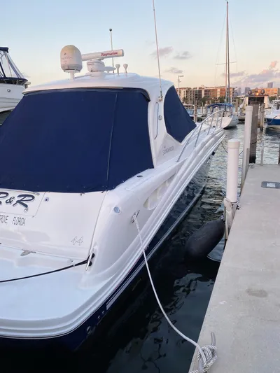 Lowest Price In Usa Yacht Photos Pics 2008 Sea Ray 44 Sundancer yacht docked at marina, featuring sleek design and navy covers.