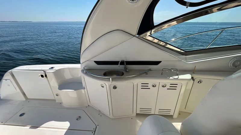 Lowest Price In Usa Yacht Photos Pics 2008 Sea Ray 44 Sundancer yacht interior with sink, cabinets, and ocean view.