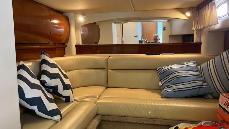 Lowest Price In Usa Yacht Photos Pics Interior of 2008 Sea Ray 44 Sundancer yacht with beige leather seating and striped cushions.