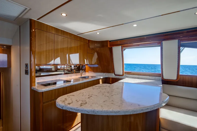 Dorothy Marie Yacht Photos Pics Luxurious interior of 2017 Viking 48 Convertible yacht with elegant wood and marble finishes.