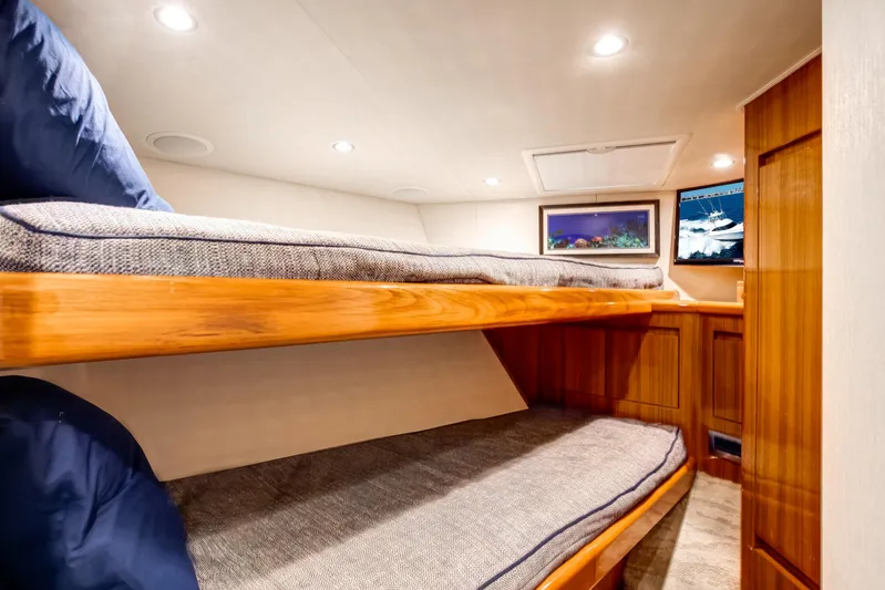 Dorothy Marie Yacht Photos Pics Interior of 2017 Viking 48 Convertible yacht with cozy wooden bunk beds.