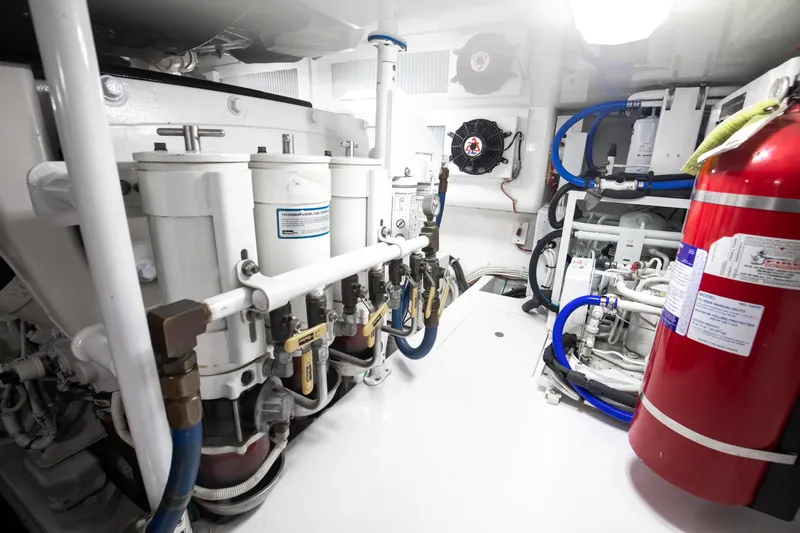 Dorothy Marie Yacht Photos Pics Engine room of 2017 Viking 48 Convertible yacht with fuel filters and fire extinguisher.