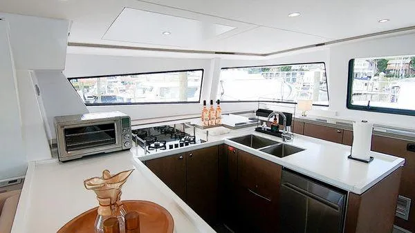 Joy Yacht Photos Pics Modern kitchen interior on 2021 Bali 5.4 yacht with appliances and sleek design.