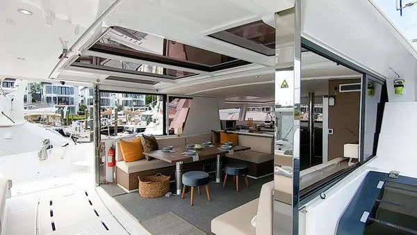 Joy Yacht Photos Pics Luxurious interior of 2021 Bali 5.4 yacht with modern seating and open design.