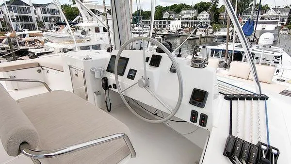 Joy Yacht Photos Pics Helm of 2021 Bali 5.4 yacht with modern controls and marina view.