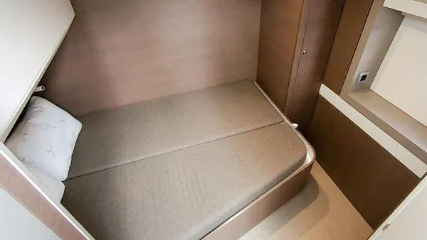 Joy Yacht Photos Pics Compact cabin bedroom in a 2021 Bali 5.4 yacht, featuring a cozy bed and modern design.