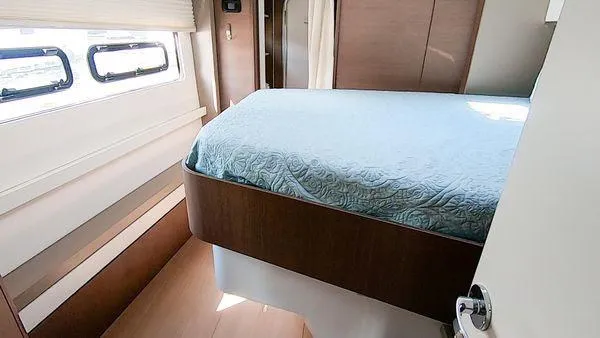 Joy Yacht Photos Pics Cozy bedroom in 2021 Bali 5.4 yacht with blue bedding and modern design.
