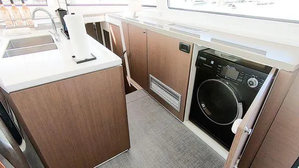 Joy Yacht Photos Pics Modern kitchen area in a 2021 Bali 5.4 yacht with integrated appliances.