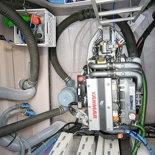Joy Yacht Photos Pics Engine room of a 2021 Bali 5.4 yacht with Yanmar engine and various hoses.