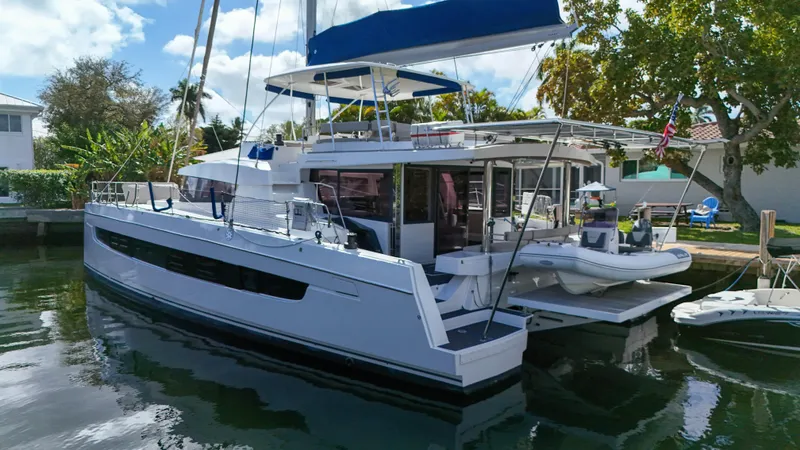 Joy Yacht Photos Pics 2021 Bali 5.4 catamaran docked, featuring spacious deck and modern design.