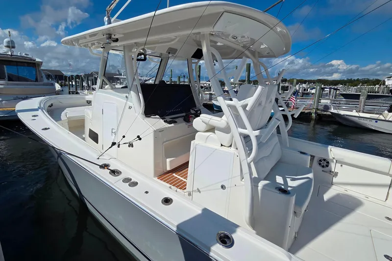  Yacht Photos Pics 2022 Regulator 37 boat docked at marina under clear blue sky.
