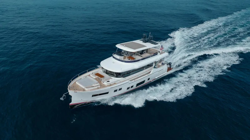 My Lady Y Yacht Photos Pics 2023 Sirena 68 yacht cruising on open sea, showcasing sleek design and luxury features.