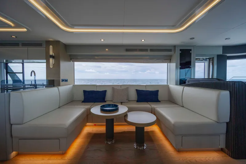 My Lady Y Yacht Photos Pics Luxurious interior of 2023 Sirena 68 yacht with elegant seating and ocean view.