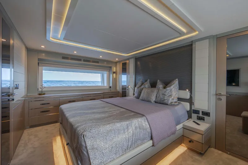 My Lady Y Yacht Photos Pics Luxurious bedroom interior of 2023 Sirena 68 yacht with ocean view.