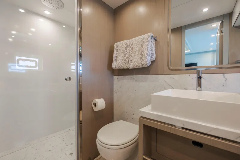 My Lady Y Yacht Photos Pics Luxurious bathroom in 2023 Sirena 68 yacht with modern fixtures and elegant design.