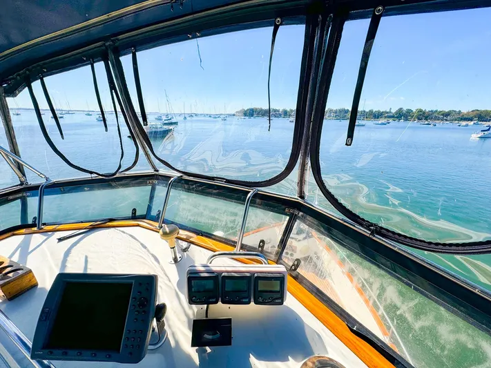 4796tw Yacht Photos Pics Interior view of 1988 Grand Banks 42 Classic yacht helm with ocean scenery.