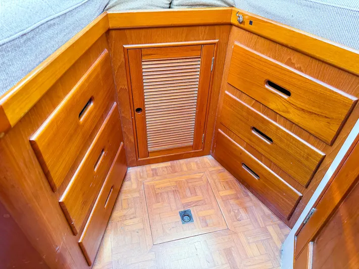4796tw Yacht Photos Pics 1988 Grand Banks 42 Classic interior with wooden cabinetry and parquet flooring.