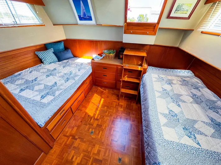 4796tw Yacht Photos Pics Cozy cabin interior of 1988 Grand Banks 42 Classic with twin beds and wooden furnishings.
