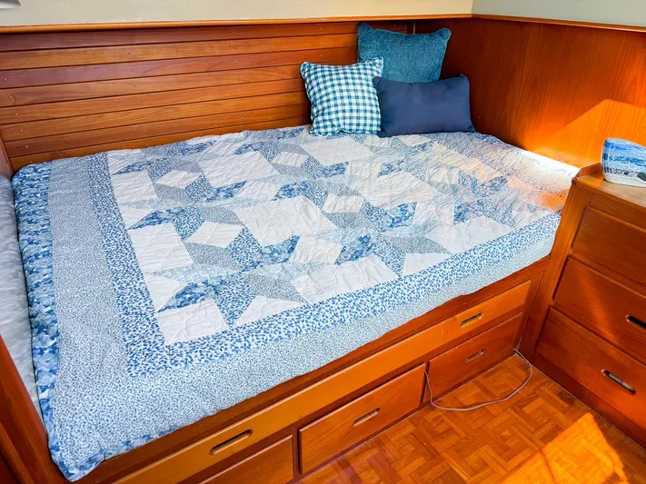 4796tw Yacht Photos Pics Cozy cabin bed with blue quilt on 1988 Grand Banks 42 Classic yacht.
