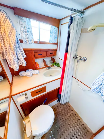 4796tw Yacht Photos Pics 1988 Grand Banks 42 Classic yacht bathroom with shower, sink, and toilet.