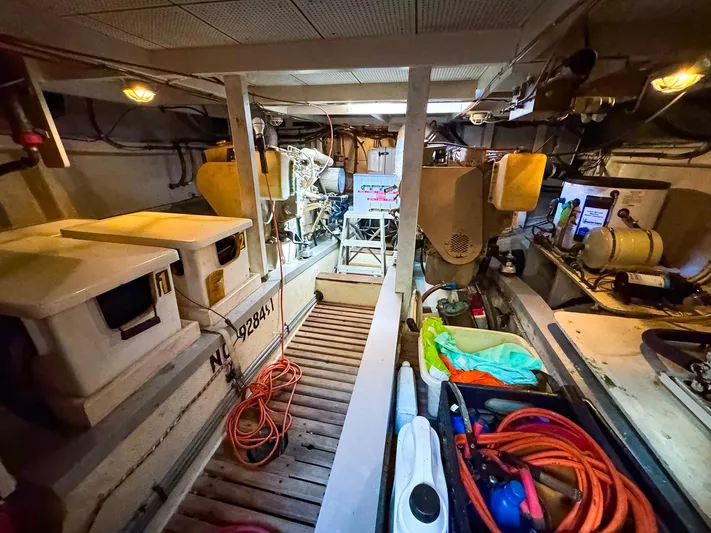 4796tw Yacht Photos Pics Engine room of 1988 Grand Banks 42 Classic yacht with equipment and storage.