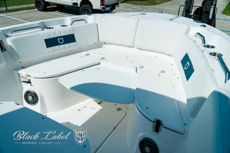 Black Label Marine Yacht Photos Pics 2025 Sea Fox 268 Commander boat interior with white seating and cup holders.