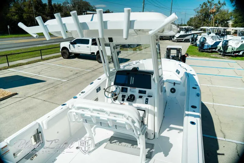 Black Label Marine Yacht Photos Pics 2025 Sea Fox 268 Commander boat with modern console and seating, parked outdoors.