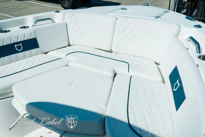 Black Label Marine Yacht Photos Pics Luxurious seating on 2025 Sea Fox 268 Commander boat with white and blue accents.