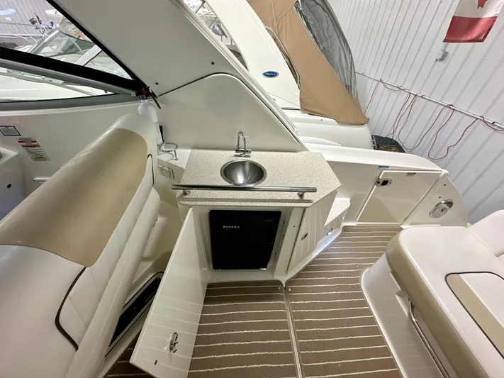  Yacht Photos Pics 2010 Sea Ray 310 Sundancer interior with kitchenette, sink, and seating.