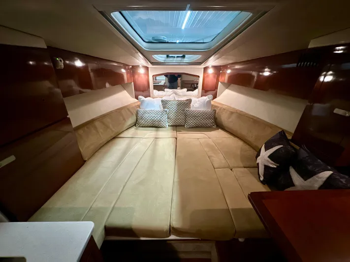  Yacht Photos Pics Luxurious interior of 2010 Sea Ray 310 Sundancer with plush seating and skylight.