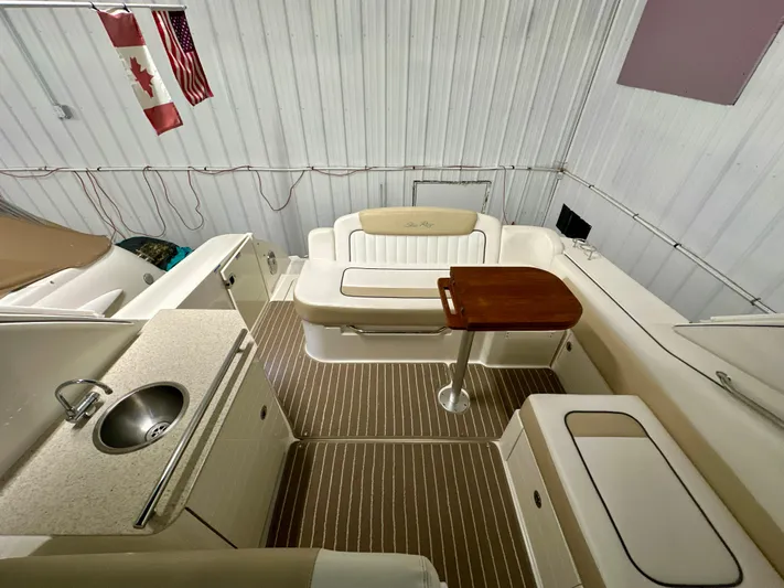  Yacht Photos Pics 2010 Sea Ray 310 Sundancer interior with seating, table, and kitchenette.