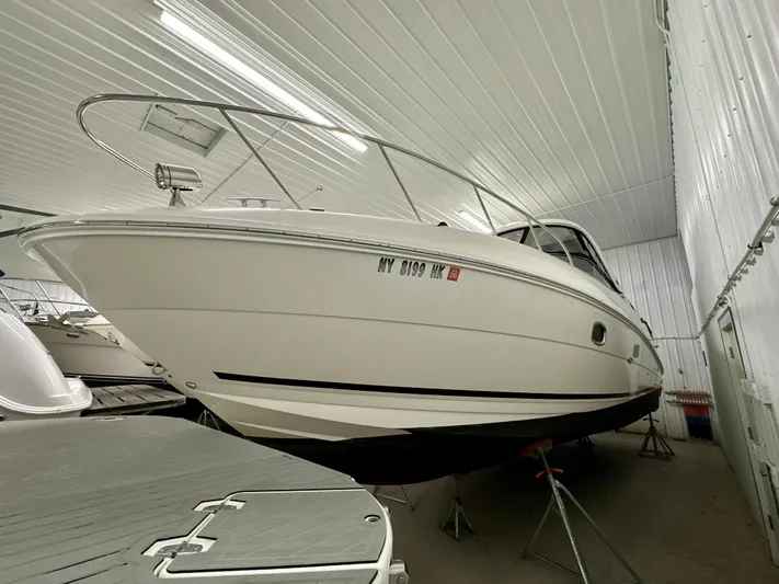  Yacht Photos Pics 2010 Sea Ray 310 Sundancer boat in indoor storage, side view.