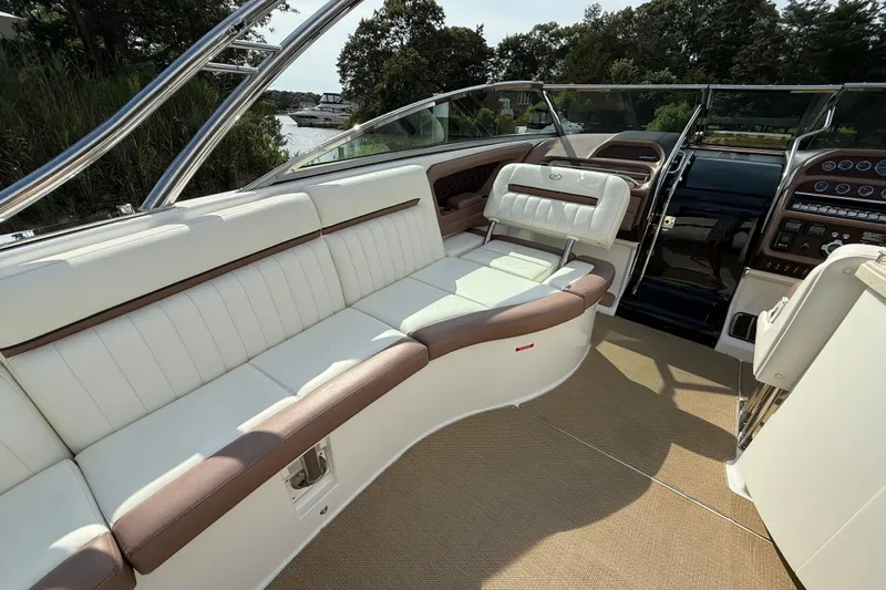  Yacht Photos Pics Luxurious interior of a 2013 Cobalt 323 boat with white and brown seating.