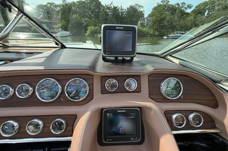  Yacht Photos Pics Dashboard of a 2013 Cobalt 323 boat with navigation system and gauges.