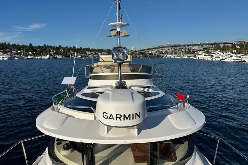 Buoy Boys Yacht Photos Pics 2025 Ranger Tugs R-29 CB yacht on water, featuring Garmin navigation system.