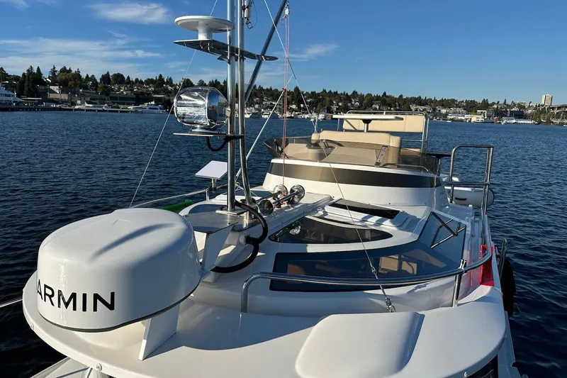 Buoy Boys Yacht Photos Pics 2025 Ranger Tugs R-29 CB boat on water, featuring Garmin equipment and scenic waterfront view.