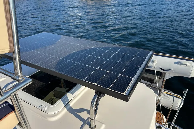 Buoy Boys Yacht Photos Pics 2025 Ranger Tugs R-29 CB with solar panel on deck, floating on water.