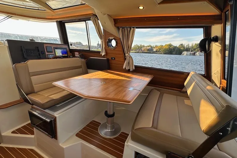 Buoy Boys Yacht Photos Pics Interior of 2025 Ranger Tugs R-29 CB with elegant seating and scenic water view.