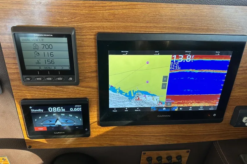 Buoy Boys Yacht Photos Pics 2025 Ranger Tugs R-29 CB dashboard with Garmin navigation and Volvo Penta engine display.