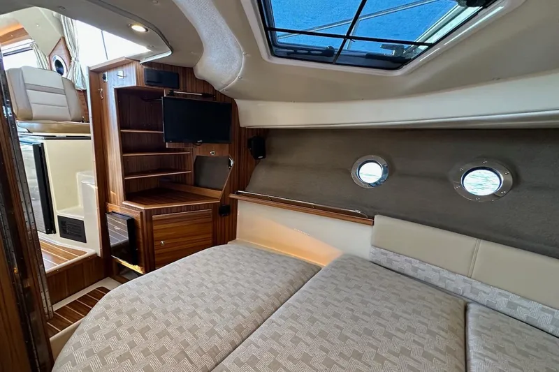 Buoy Boys Yacht Photos Pics 2025 Ranger Tugs R-29 CB interior with cozy cabin, skylight, and modern amenities.
